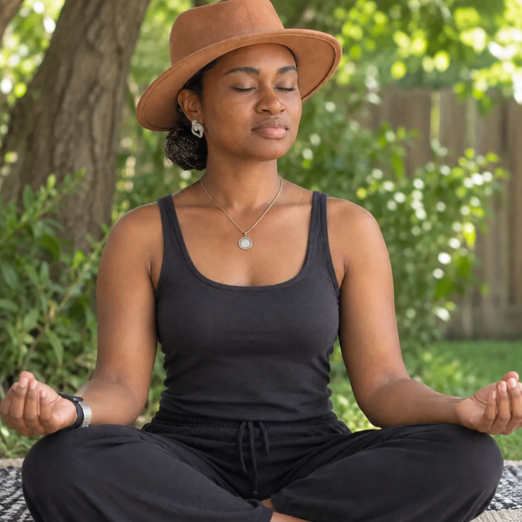 A woman sitting in a calm meditation pose